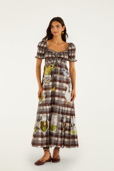 Brown tartan midi smocked dress featuring playful farm prints, short ruffled sleeves, and a square neckline.