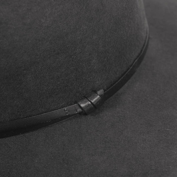 Black fedora hat made of soft wool felt, featuring a sleek leather trim for a polished look.