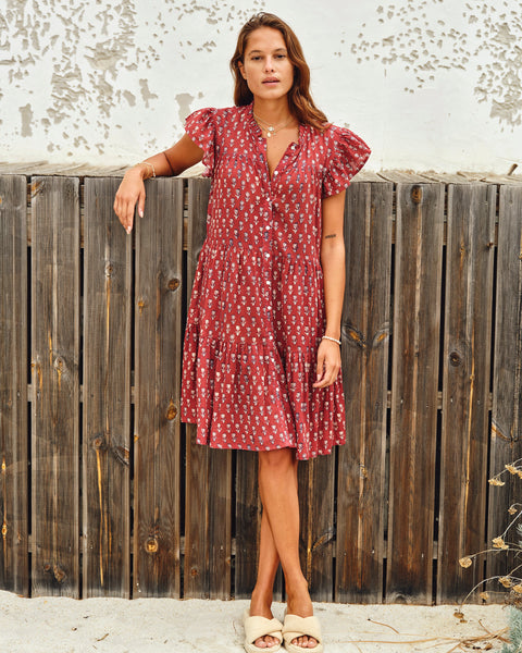 Ari Print Frill Dress in deep red cotton with white and navy floral block print, frill collar, cap sleeves, and tiered skirt