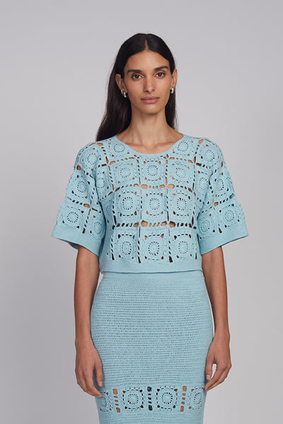 Arden Cotton Crochet Top in Skye Blue with grandma squares stitch, short sleeves, braided back-neck tie and keyhole detail