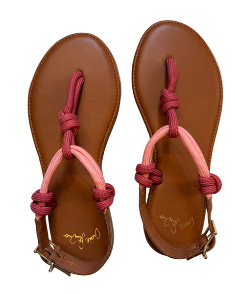 Pair of brown sandals with pink straps on a white surface | Craie Studio | idPearl Boutique New York