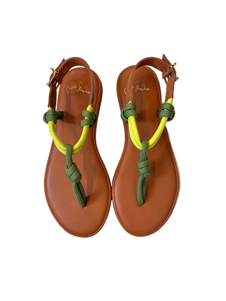 Pair of brown sandals with green and lime straps on a white background | Craie Studio | idPearl Boutique New York
