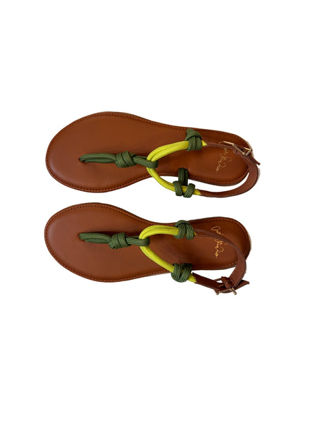 Pair of brown sandals with green and lime straps on a white surface | Craie Studio | idPearl Boutique New York