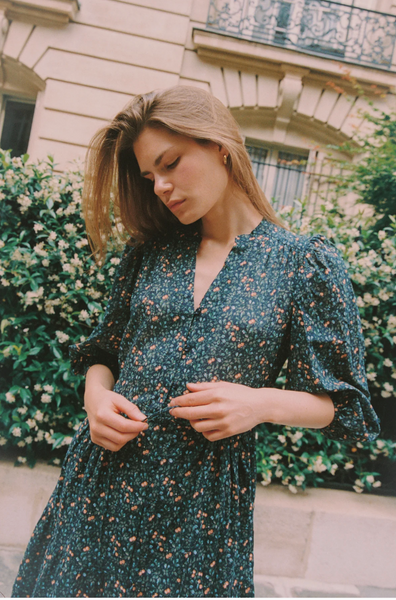 Navy floral midi dress with 3/4 puff sleeves, v-neckline, and self-fabric drawstring waist, styled with casual elegance.